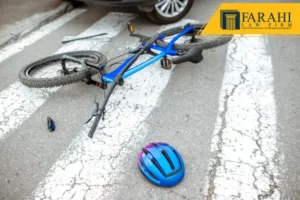 Scene of a road accident with a car and a damaged bicycle