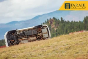 Image of a car flipped off the side of a highway