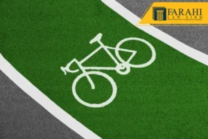 Icono blanco de bicicleta en un carril bici verde.